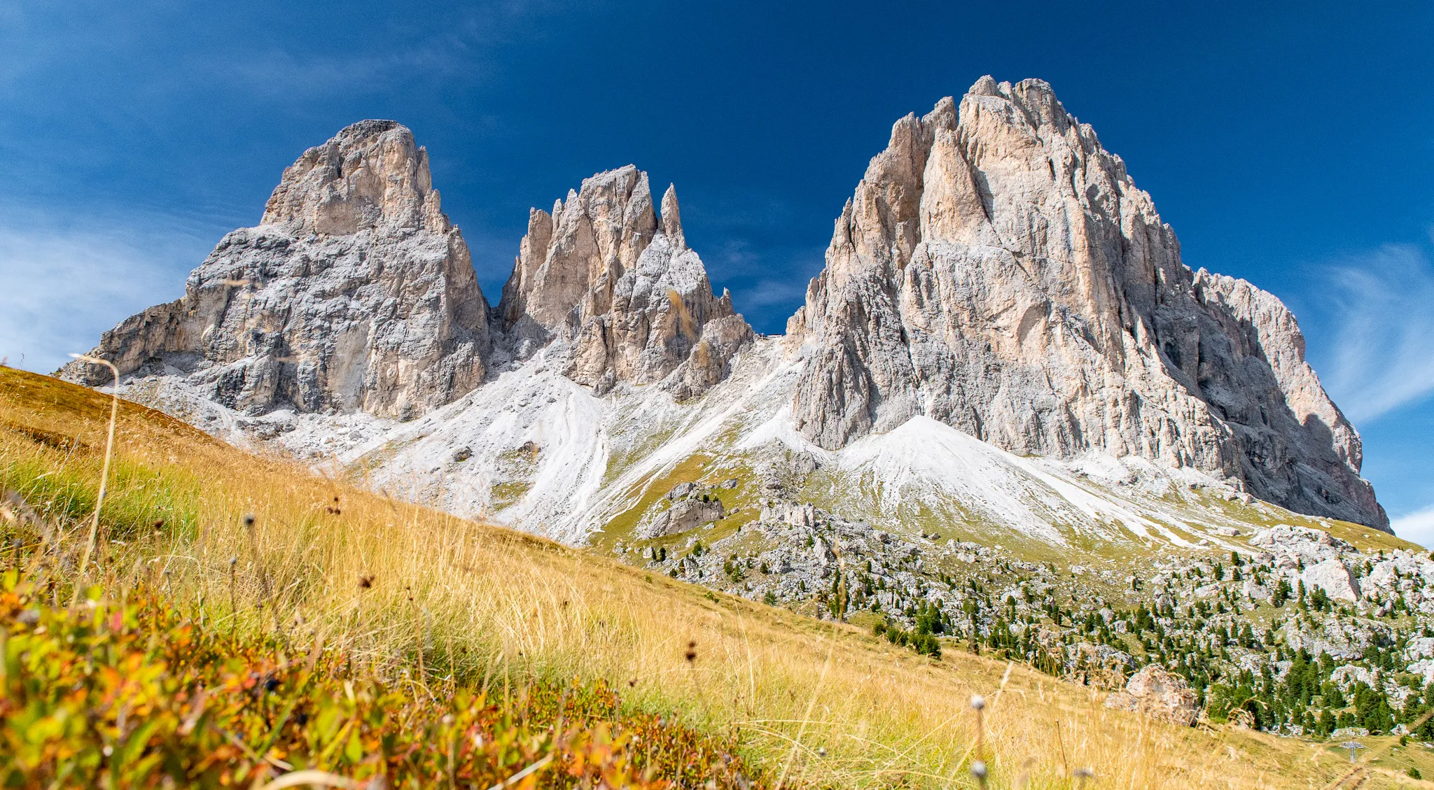 Sassolungo mountain massif on a clear sunny afternoon, Dolomites, Italy.